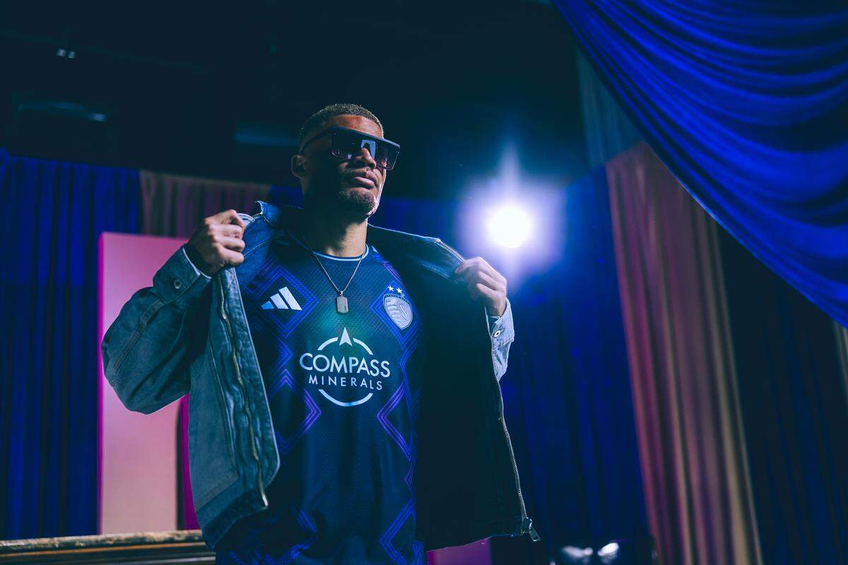 Sporting KC’s Zorhan Bassong models the club’s “18th & Vine” secondary jersey for the 2026-27 Major League Soccer season.