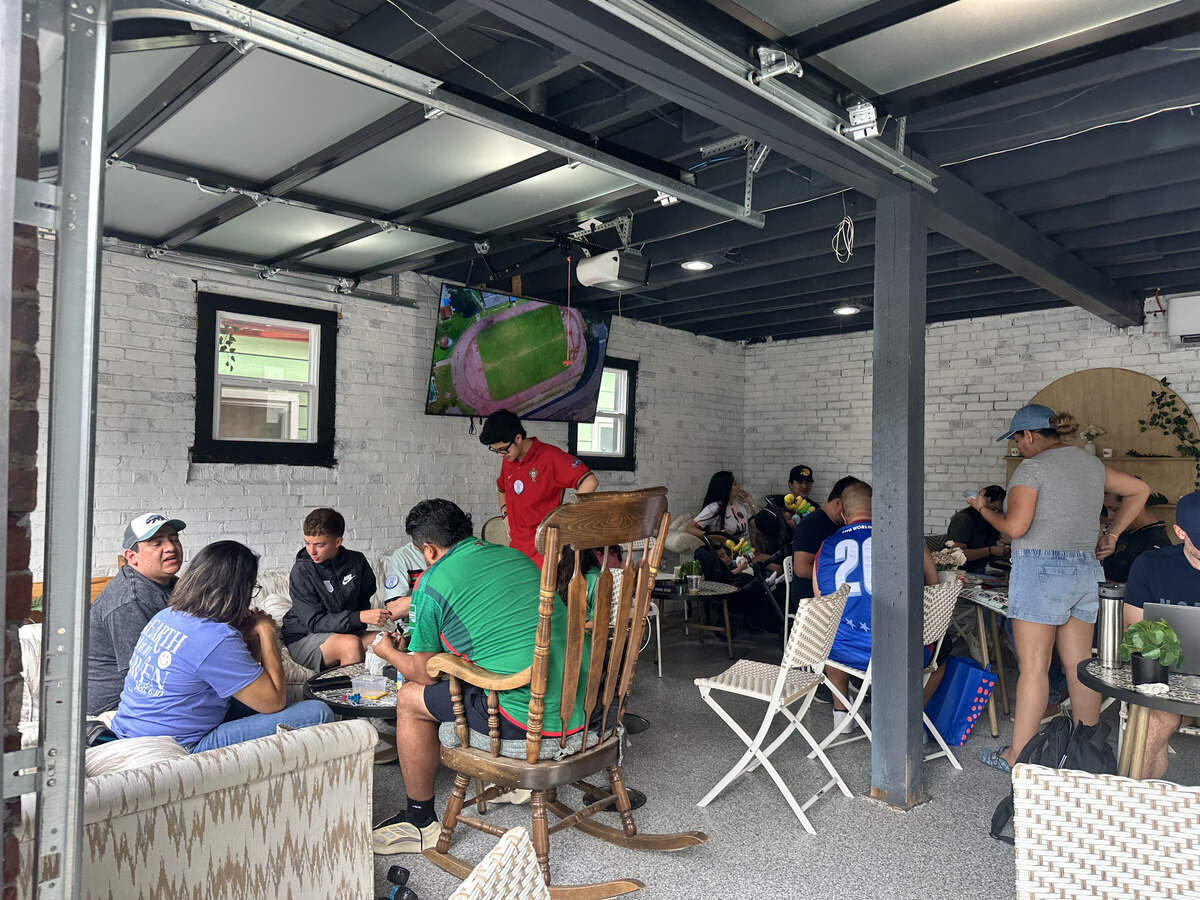 Behind Cortadito Cuban Cafe in Kansas City, Kansas, families gather to trade Panini cards in the cafe’s garage on June 13. The cafe has hosted a few events to help locals get rid of their duplicates.