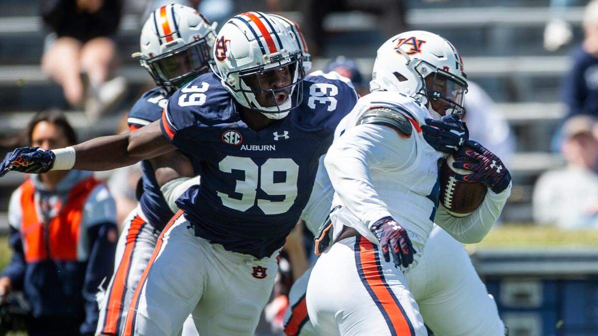 Auburn Tigers edge Dylan Brooks (39) tackles running back Sean Jackson (44) during the A-Day spring practice at Jordan-Hare Stadium in Auburn, Ala., on Saturday, April 9, 2022.