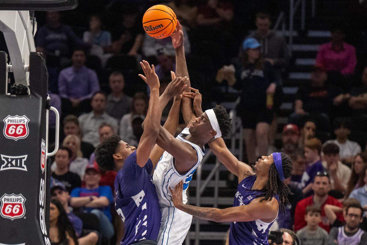 BYU Cougars forward AJ Dybantsa (3) gets double teamed by Kansas State Wildcats defenders in the first half of the Wildcats first round game vs. the BYU Cougars in the Big 12 Men's Basketball Tournament, on Tuesday, March 10, 2026, at T-Mobile Center. The Wildcats lost to BYU, 105-91.