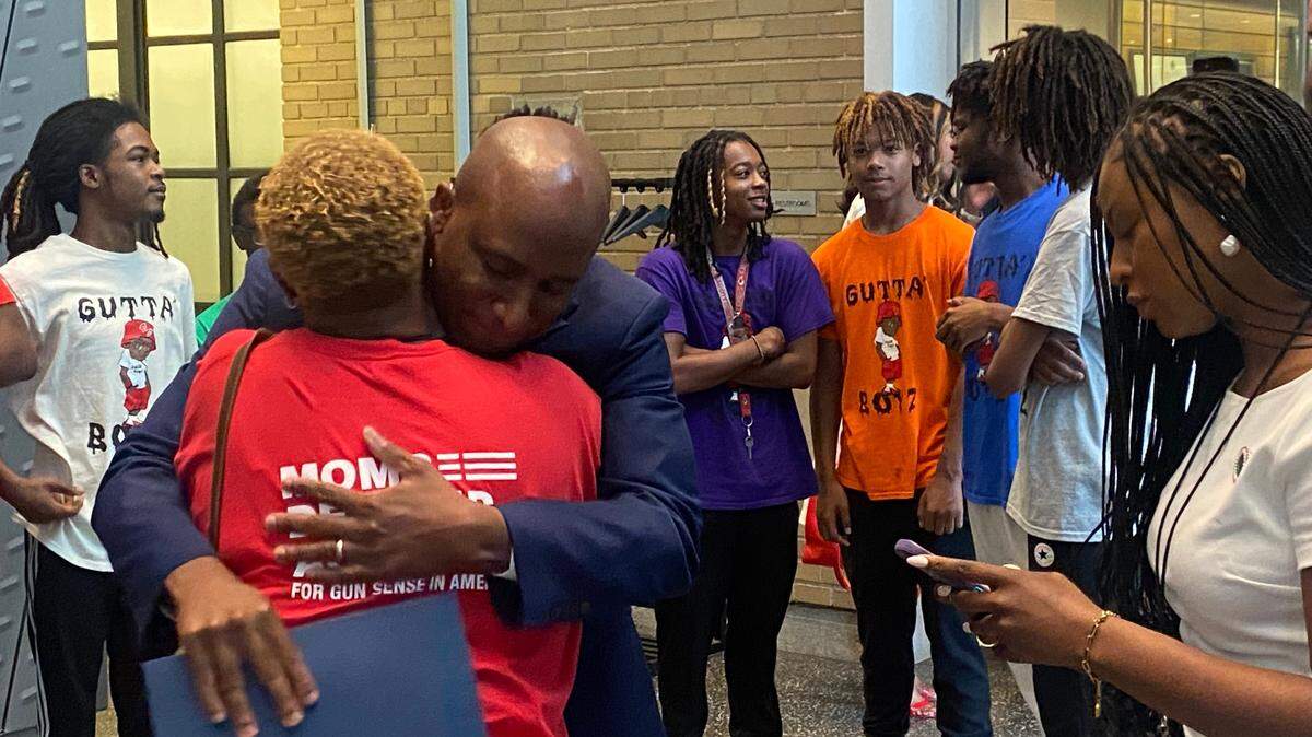 After an hour of listening to stories about the need to curb gun violence, Kansas City Mayor Quinton Lucas hugged a member of Moms Demand Action on Tuesday in the lobby of Kansas City Police Headquarters.