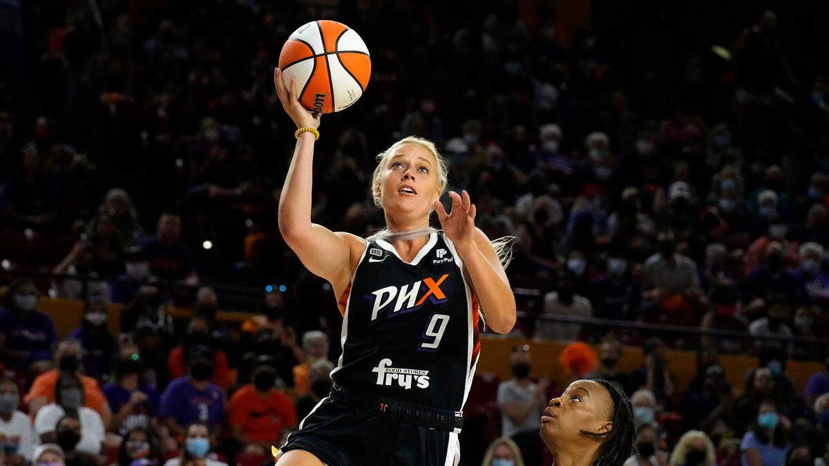 Phoenix Mercury guard Sophie Cunningham (9) drives past Las Vegas Aces guard Riquna Williams during the first half of a WNBA basketball game Sunday, Oct. 3, 2021, in Phoenix. (AP Photo/Rick Scuteri)