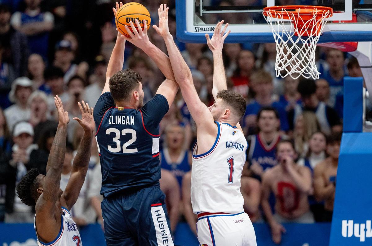 Kansas Jayhawks center Hunter Dickinson (1) contests a shot by Connecticut Huskies center Donovan Clingan (32) during an NCAA basketball game on Friday, Dec. 1, 2023, in Lawrence, Kan.