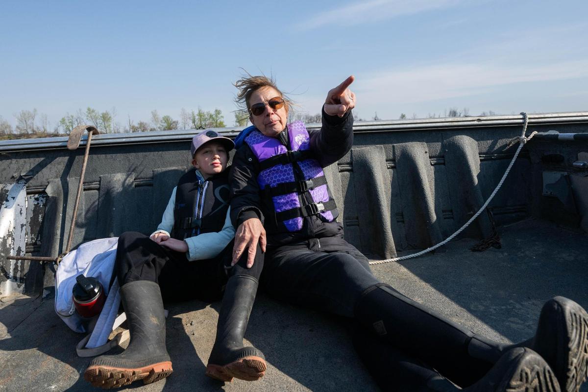 Lisa LaCombe and her granddaughter, Reece, 8, ride in a boat on the Missouri River during an event held by Missouri River Relief.