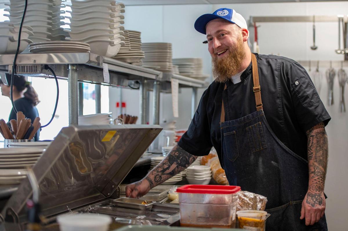 Graham Farris, chef and co-owner of Brady and Fox, prepares an order in the open-style kitchen.