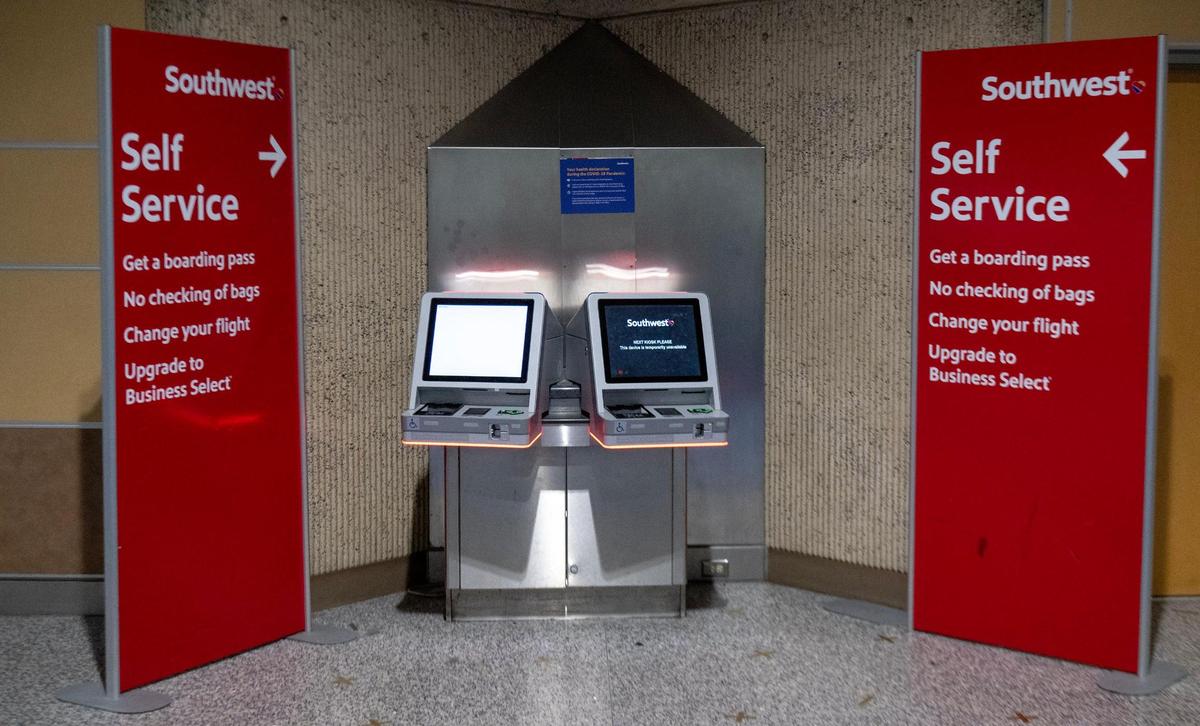 A Southwest Airlines kiosk remains in an empty terminal B on the last day of operation at Kansas City International Airport’s old terminals on Monday, Feb. 27, 2023, in Kansas City.