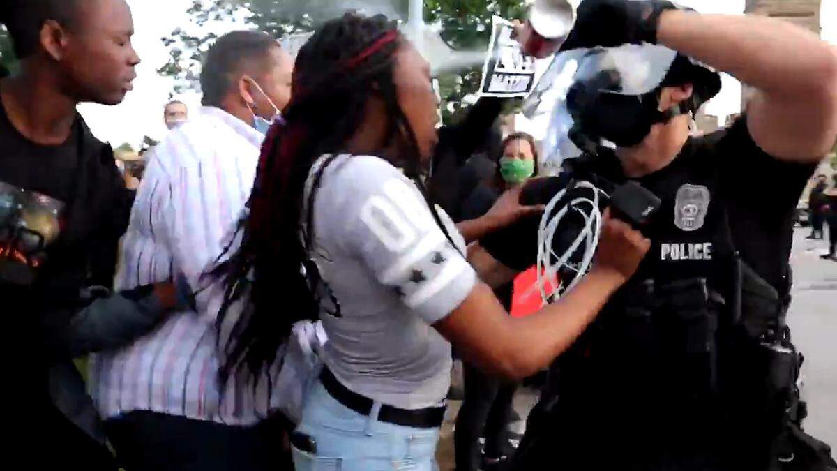 A viral video captured a protester in Kansas City getting pepper sprayed in the face after yelling at police May 30, 2020.