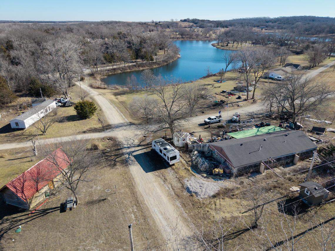 The home of Damon B. Leonard, 47, lower right, is seen in the Holiday Lakes neighborhood on Monday, Jan. 12, 2026, in Pleasanton, Kansas, in Linn County.  Leonard is being held in the Bates County Jail on a $100,000 cash-only bond with a charge of abandonment of a corpse. This charge alleges that Leonard moved the deceased teenager, Airen Andula, 13, a neighbor, from Kansas to Missouri and left the body in a creek bed. Other charges in Linn County include Interference with Law Enforcement, Criminal Desecration and having a Vicious Dog at Large. Airen, a neighbor, died of “multiple dog bite injuries,” according to an autopsy conducted by the Wyandotte County Kansas Coroner's Office.