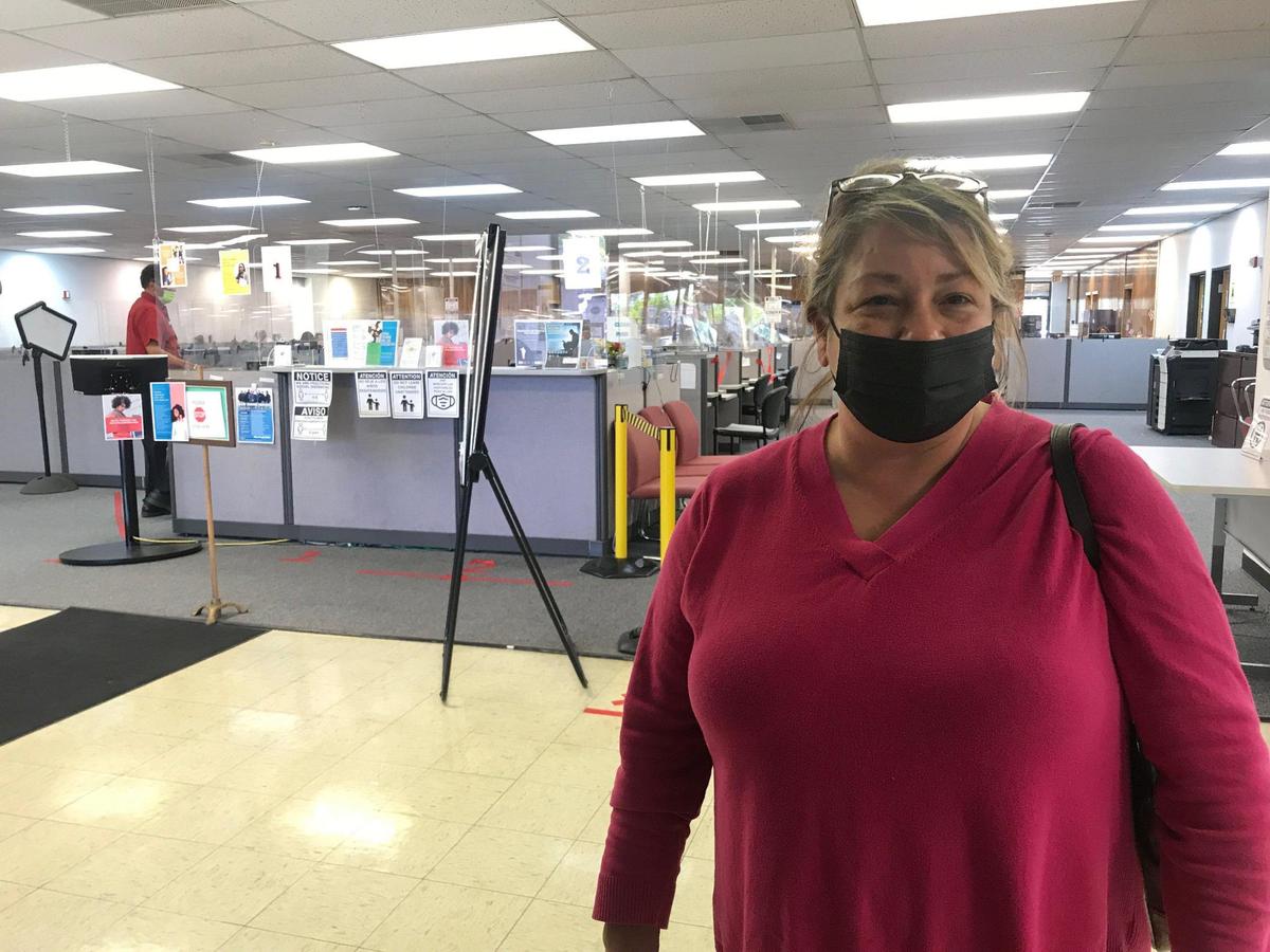 Jennifer Yardley, an out of work hair stylist, checked on her unemployment benefits this past week in Independence. She will soon lose her extra $300 per week payments.