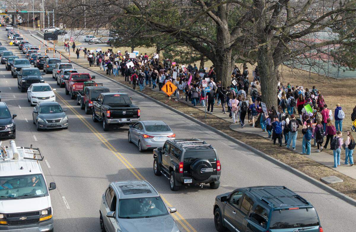 Students at Shawnee Mission North High School marched in protest of ICE and the Trump administration along Johnson Drive on Wednesday, February 11, 2026, in Overland Park.