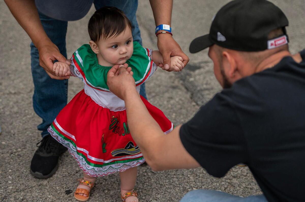Ten-month-old Isabella Mascote stares at a stranger in confusion during the Cinco de Mayo celebration at Guadalupe Centers on Friday, May 5, 2023, in Kansas City.