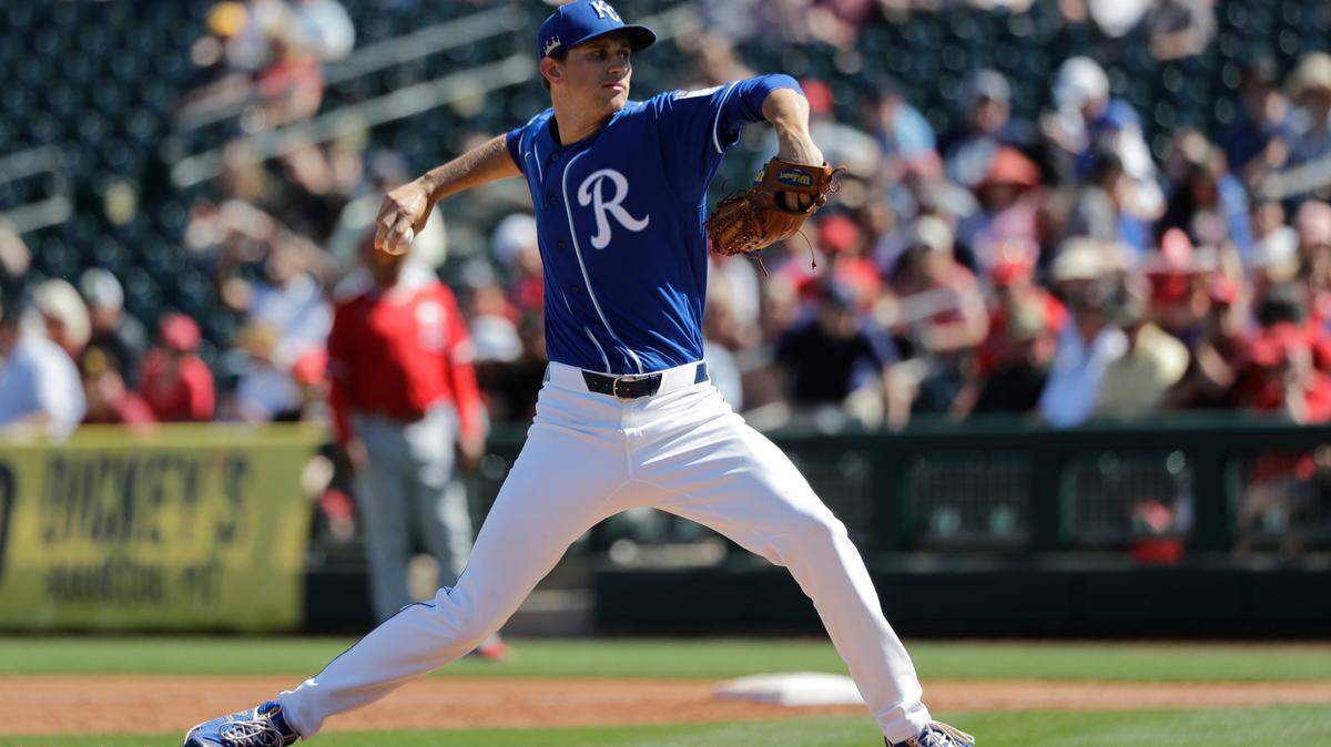 Kansas City Royals relief pitcher Jackson Kowar throws against the Los Angeles Angels during a spring training baseball game Friday, March 6, 2020, in Surprise, Ariz. (AP Photo/Elaine Thompson)