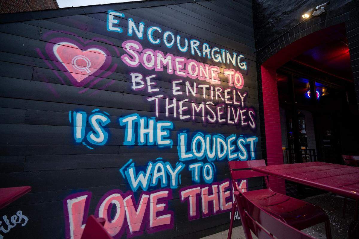 A mural by artist Kalen Dion is displayed outside in the front patio area at Q Kansas City, and LGBTQ-centric bar and nightclub.
