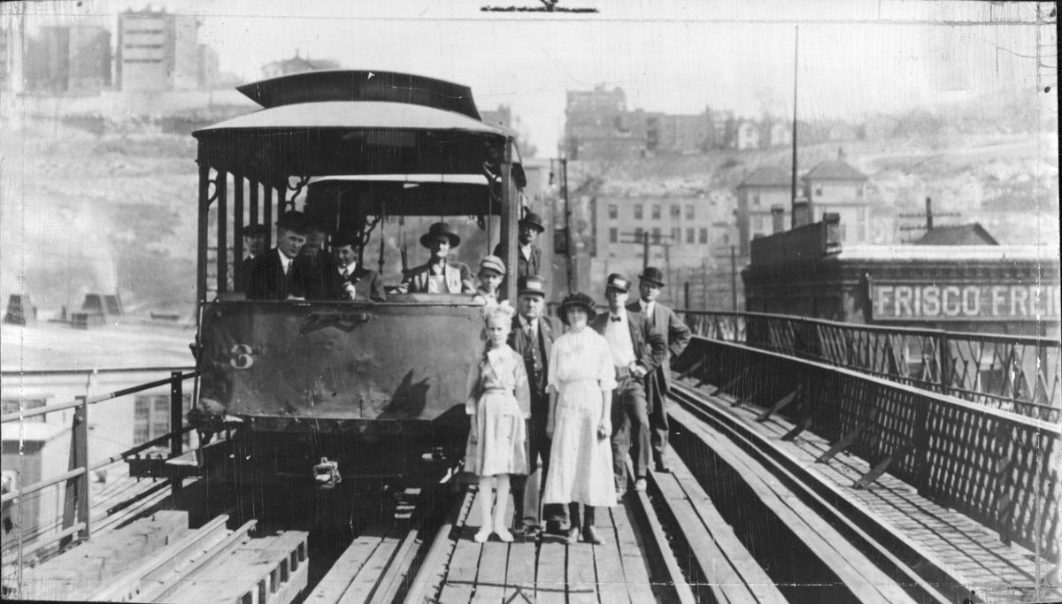 One of the old Kansas City cable cars on the 12th Street viaduct in 1913. Young pranksters would tie metal wash tubs to the moving cable.