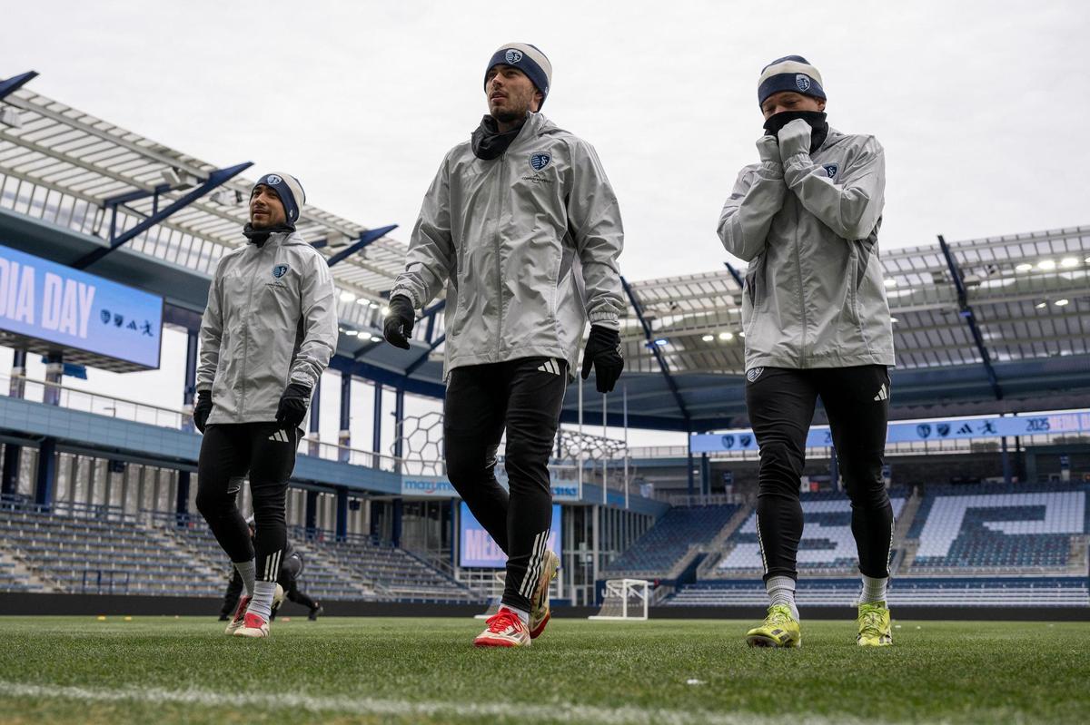 Sporting Kansas City players, bundled up against the cold, go through drills during practice at Children’s Mercy Park on Friday, Feb. 14, 2025, in Kansas City, Kansas.