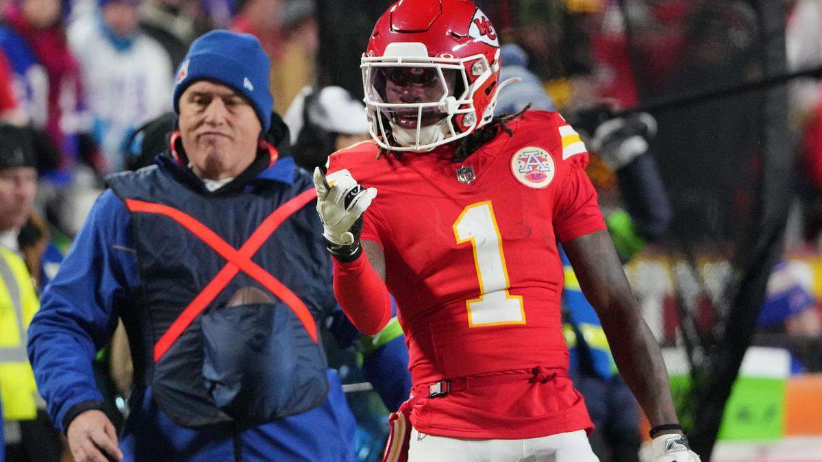 Kansas City Chiefs wide receiver Xavier Worthy signaled for a first down against the Buffalo Bills during the first half in the AFC Championship Game at GEHA Field at Arrowhead Stadium.