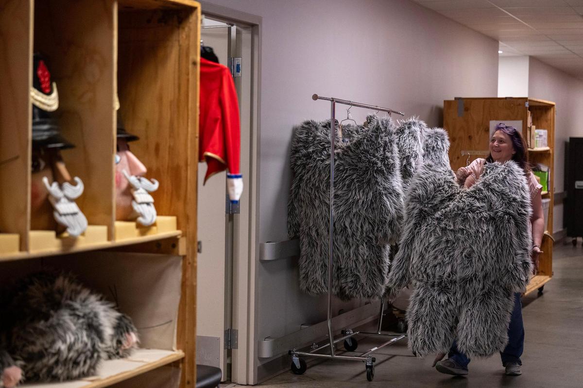 Jennifer Carroll, costume director for the Kansas City Ballet, unpacks the furry mouse costumes on load-in day on Nov. 26, 2024, backstage at the Kauffman Center for the Performing Arts, as preparations for “The Nutcracker” were underway.