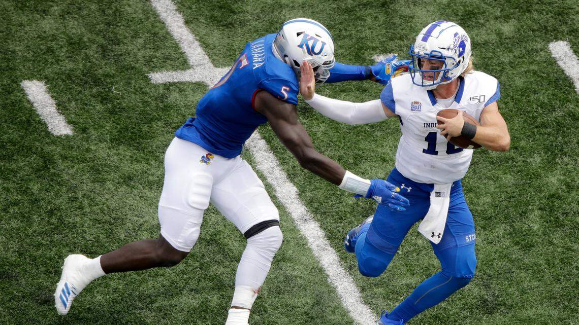 Indiana State quarterback Ryan Boyle (10) is sacked by Kansas linebacker Azur Kamara (5) during the second half of an NCAA college football game Saturday, Aug. 31, 2019, in Lawrence, Kan. Kansas won 24-17. AP Photo/Charlie Riedel)
