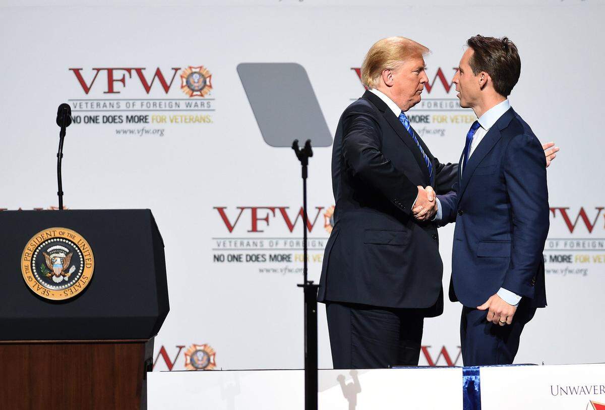 In 2018, President Donald Trump greeted Josh Hawley, then Missouri’s attorney general, before speaking at the Veterans of Foreign Wars National Convention at Kansas City’s Municipal Auditorium.
