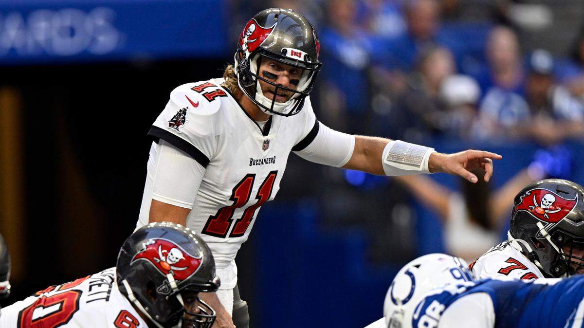 Tampa Bay Buccaneers quarterback Blaine Gabbert (11) points before taking the snap during the first quarter of the game against the Indianapolis Colts at Lucas Oil Stadium.