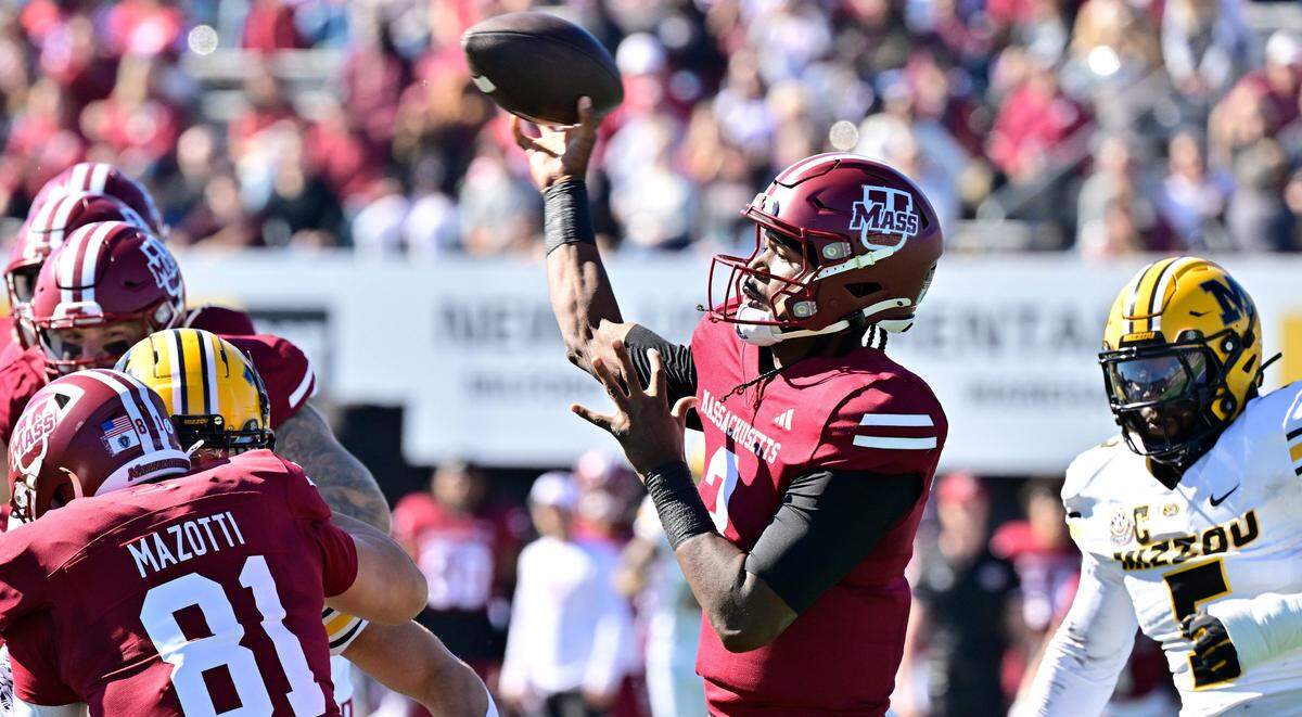 UMass Minutemen quarterback Taisun Phommachanh throws a pass during Saturday’s game against the Missouri Tigers at Warren McGuirk Alumni Stadium in Amherst, Mass.