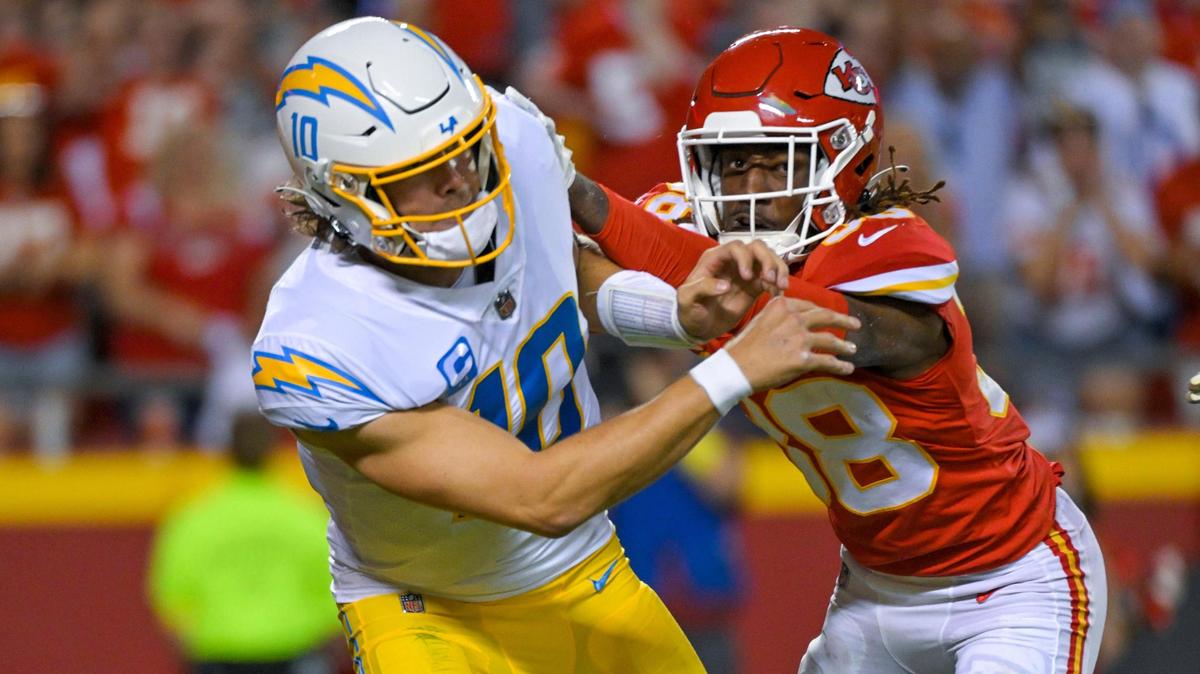 Kansas City Chiefs cornerback L’Jarius Sneed (38) pressures Los Angeles Chargers quarterback Justin Herbert (10) in the second-half on Thursday, Aug. 15,2022 at Arrowhead Stadium in Kansas City.