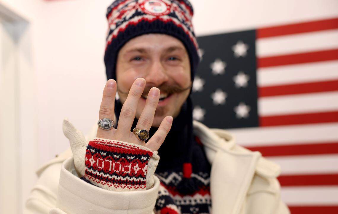 Team USA para snowboarder Noah Elliott of St. Charles, Missouri, displays his Paralympic rings from previous Games on March 2, 2026 in Venice, Italy.