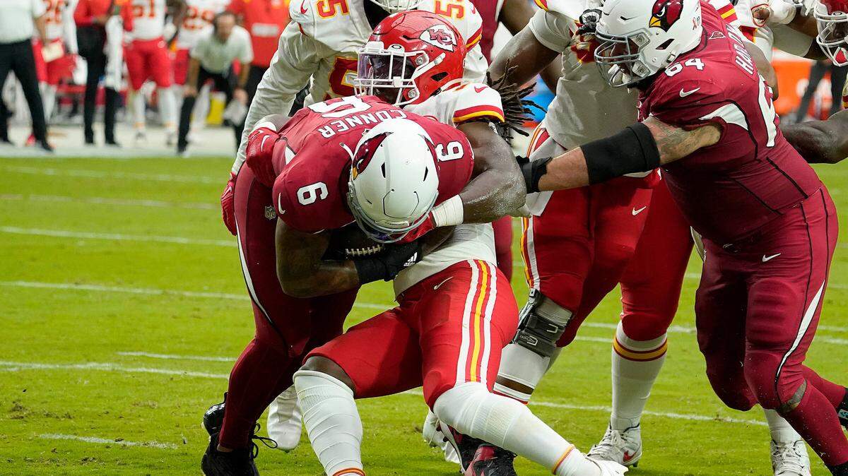 Arizona Cardinals running back James Connor (6) fights in way into the end zone for a touchdown against Kansas City Chiefs linebacker Nick Bolton (32) during the first half of an NFL football game, Sunday, Sept. 11, 2022, in Glendale, Ariz.