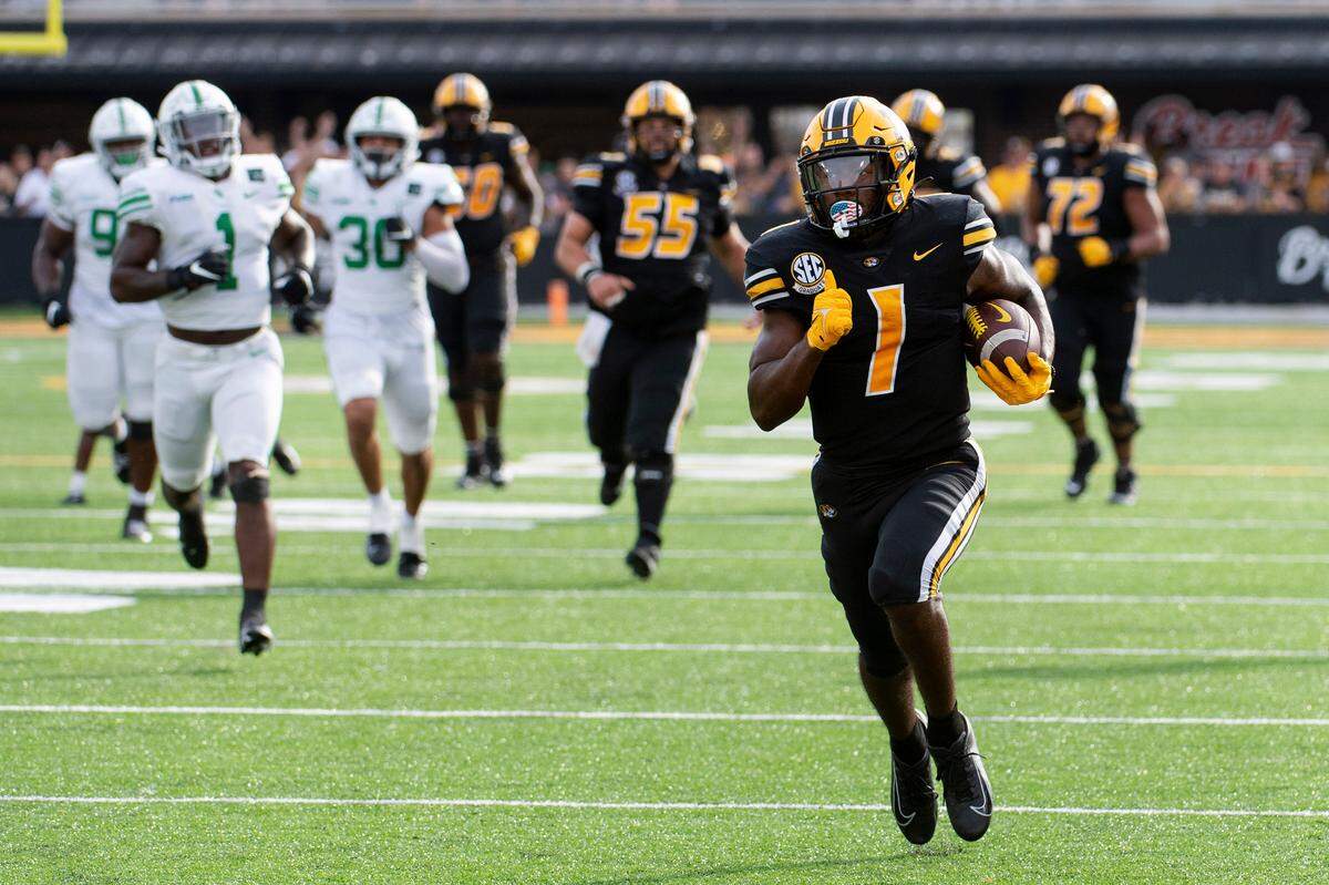 The Missouri Tigers’ Tyler Badie outran a pack of Mean Green en route to a touchdown against North Texas last weekend in Columbia.