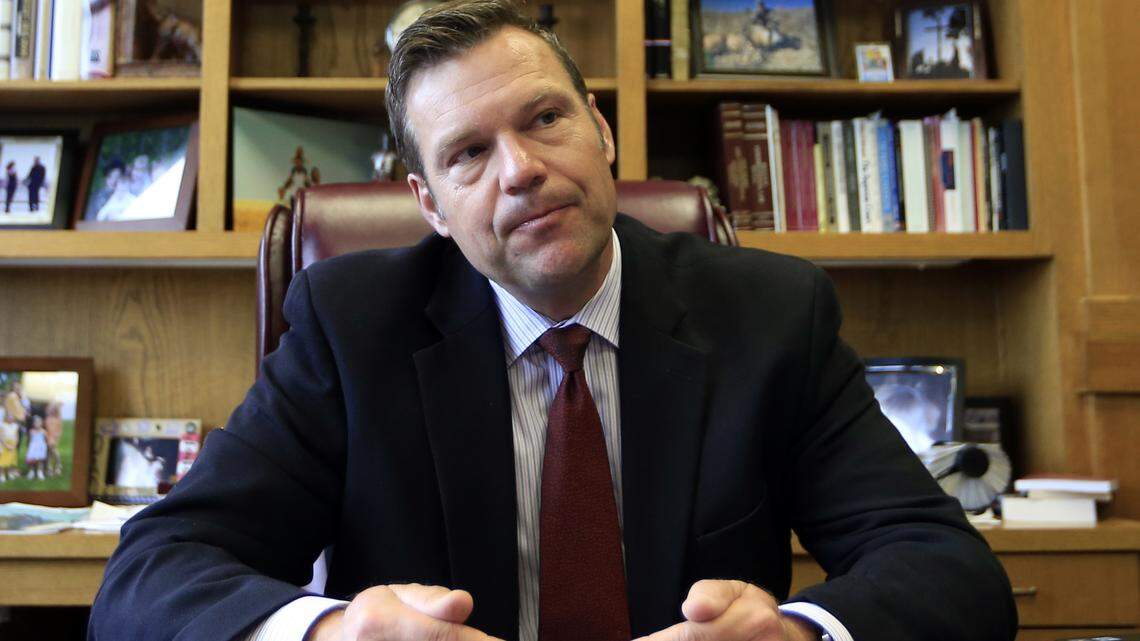 In this May 17, 2017, file photo, Kansas Secretary of State Kris Kobach talks with a reporter in his office in Topeka, Kan.