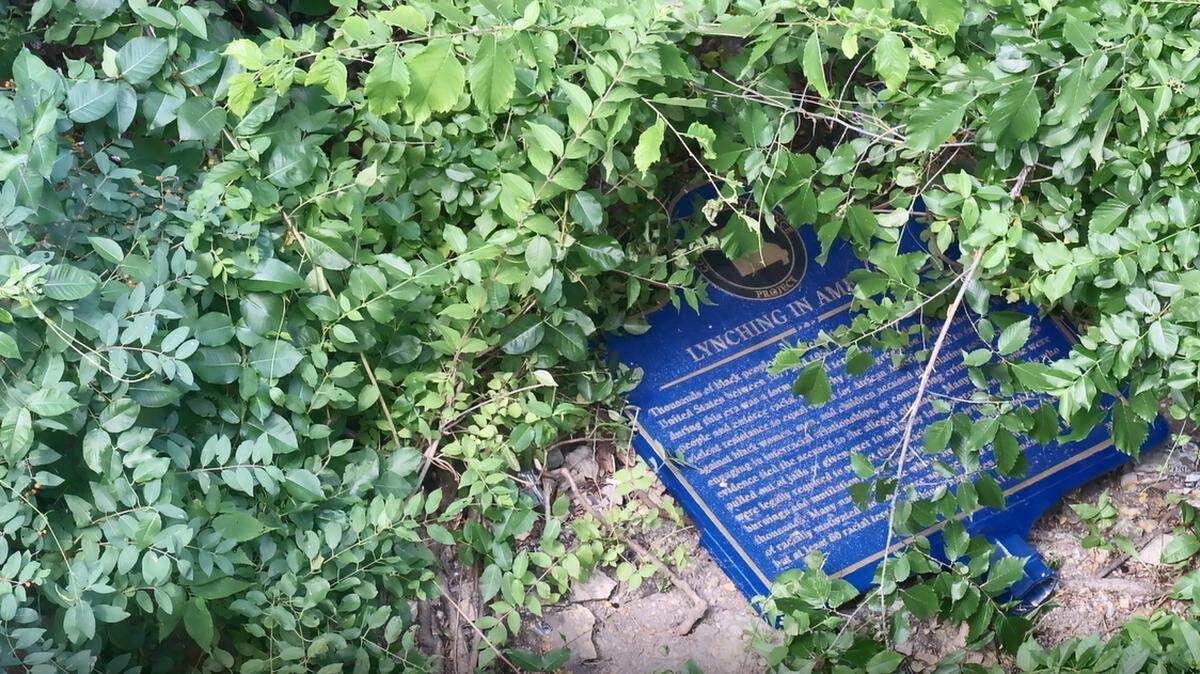 A plaque commemorating the 1882 lynching of Levi Harrington was defaced and thrown down a cliff just a few years ago.