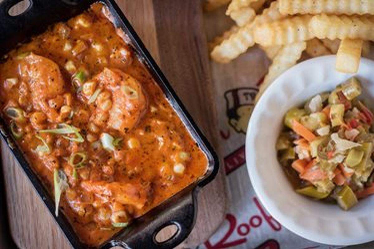 Tin Roof features a Southern-inspired menu of made-from-scratch items. Its Voodoo Shrimp has shrimp in creole sauce with corn, fresh cream and scallions.