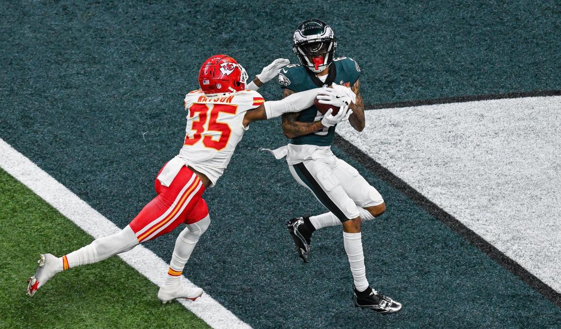 Philadelphia Eagles wide receiver DeVonta Smith (6) catches a bomb pass from quarterback Jalen Hurts over the defense of Kansas City Chiefs cornerback Jaylen Watson (35) in the third quarter during Super Bowl LIX on Sunday, Feb. 9, 2025, in New Orleans.