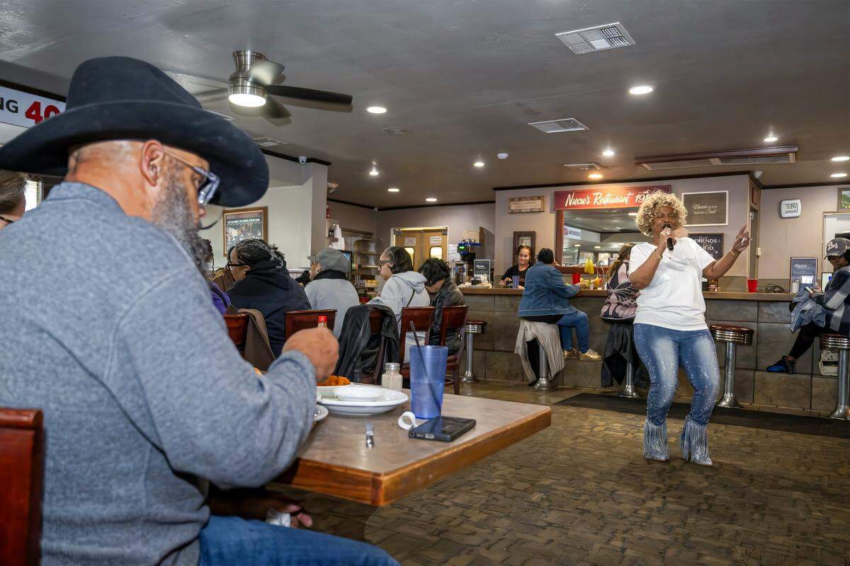 Denise “Ms. Niecie” Ward performs old-school hits during “Dinner & A Show” at Niecie's Restaurant in Kansas City on Friday, Feb. 6, 2026. Ward performs on the First Friday of every month at her soul food restaurant.