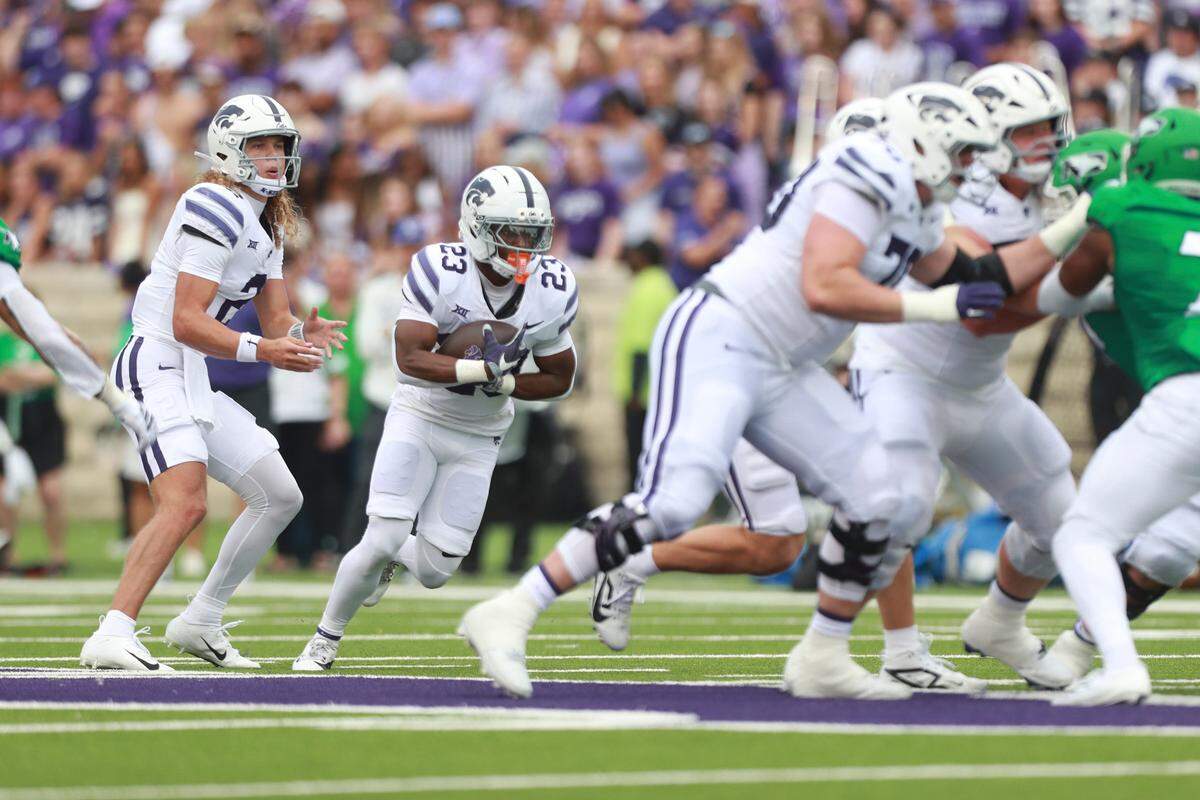 Kansas State Wildcats quarterback Avery Johnson (2) gives the ball to running back DeVon Rice (23) during the first half against the North Dakota Fighting Hawks at Bill Snyder Family Stadium on Aug. 30, 2025.