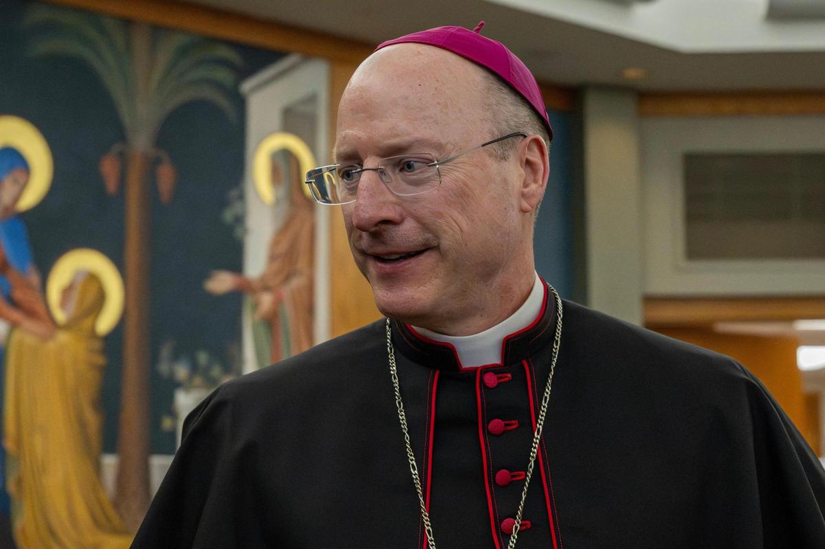 Archbishop Shawn McKnight, of the Archdiocese of Kansas City, Kansas, addresses the media following his installation ceremony.