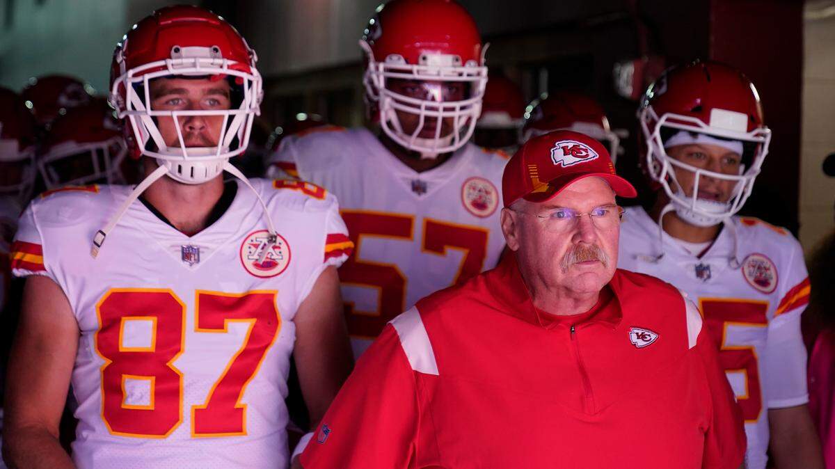 Kansas City Chiefs head coach Andy Reid, center, waiting in the tunnel to take the field with members of his team before the start of an NFL football game against the Washington Football Team, Sunday, Oct. 17, 2021, in Landover, Md. Standing behind Reid are from l-r, tight end Travis Kelce (87), offensive tackle Orlando Brown (57) and quarterback Patrick Mahomes (15). (AP Photo/Alex Brandon)