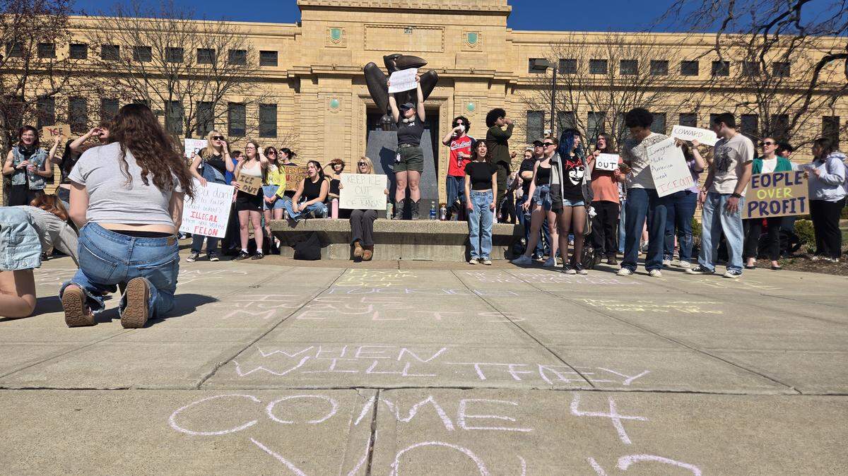 Protesters chant outside of Strong Hall at the University of Kansas campus in Lawrence, Kansas, in response to an alleged ICE detention on Feb. 27.