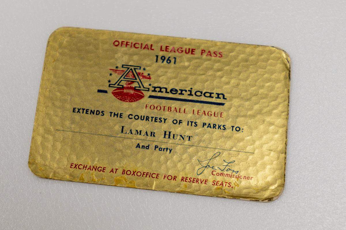 An official league pass, dated 1961 and issued to Kansas City Chiefs founder Lamar Hunt, is stored inside the library of the team’s underground storage facility in Kansas City.