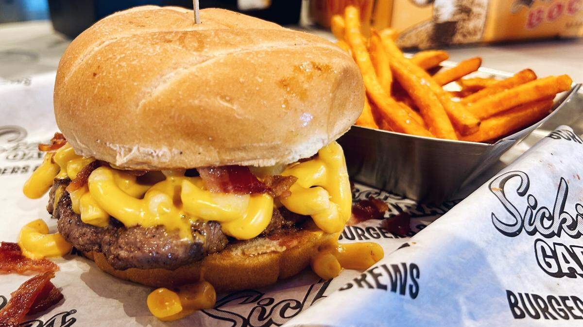 Sickies Garage sells “supercharged burgers” with unconventional toppings, like its macaroni and cheese burger.
