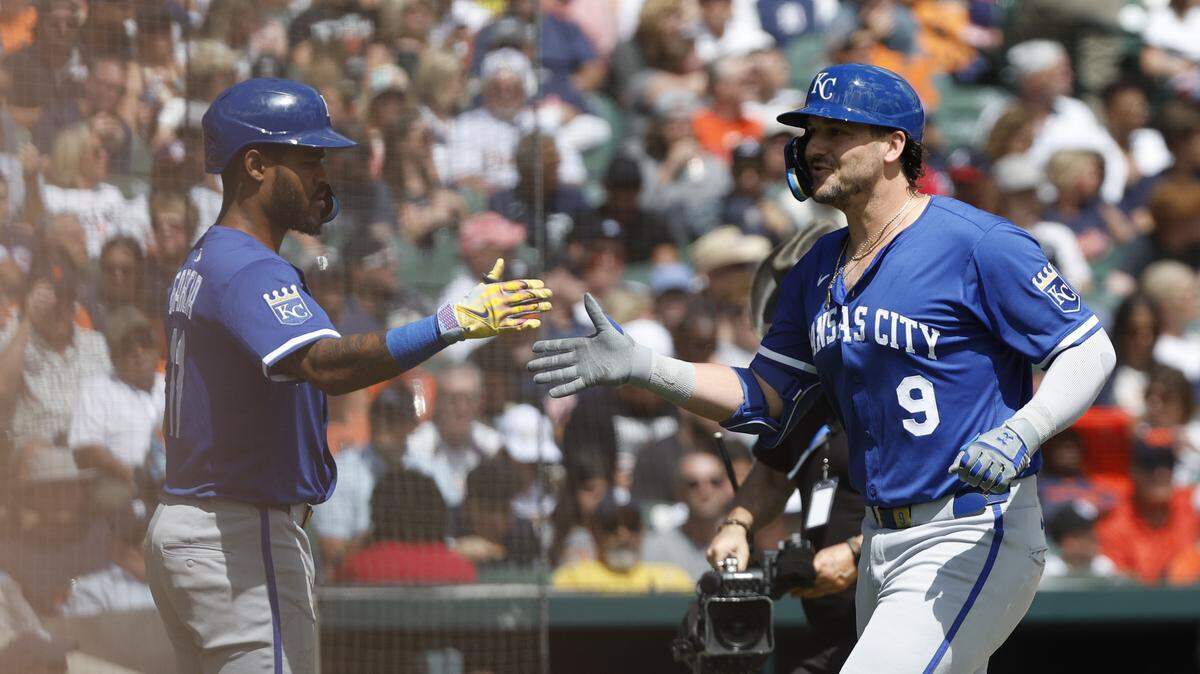 Aug 24, 2025; Detroit, Michigan, USA; Kansas City Royals first baseman Vinnie Pasquantino (9) high-fives third baseman Maikel Garcia (11) during the third inning at Comerica Park. Mandatory Credit: Brian Bradshaw Sevald-Imagn Images