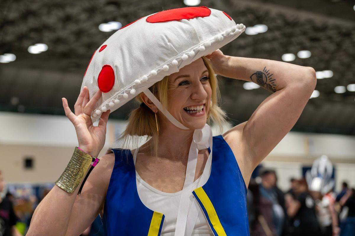 Brenna Castor, cosplaying as Toad from the Super Mario Bros. franchise, stands for a portrait during Planet Comicon at the Kansas City Convention Center on Friday, March 21, 2025.