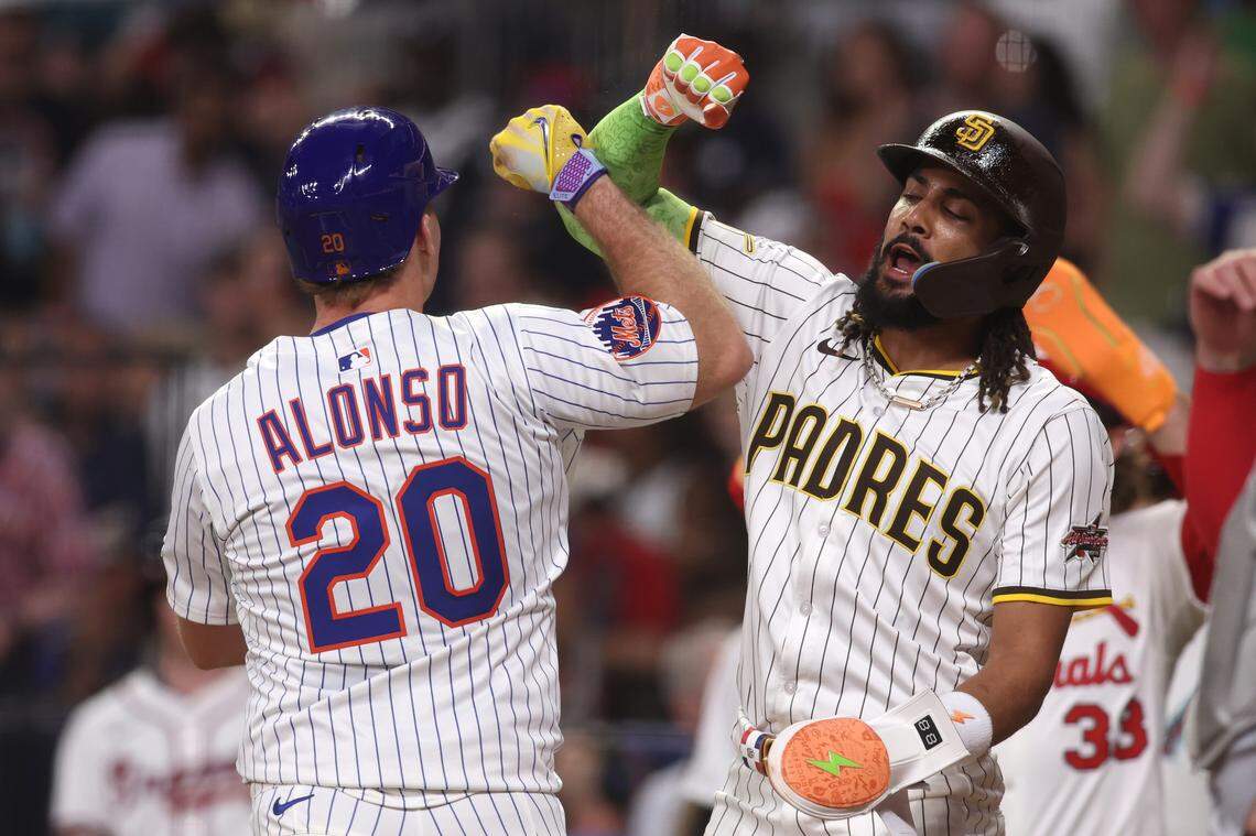 National League first baseman Pete Alonso of the New York Mets celebrates his sixth-inning homer off Royals pitcher Kris Bubic with NL outfielder Fernando Tatis Jr. of the San Diego Padres during the 2025 MLB All-Star Game at Truist Park in Atlanta on Tuesday, July 15, 2025.
