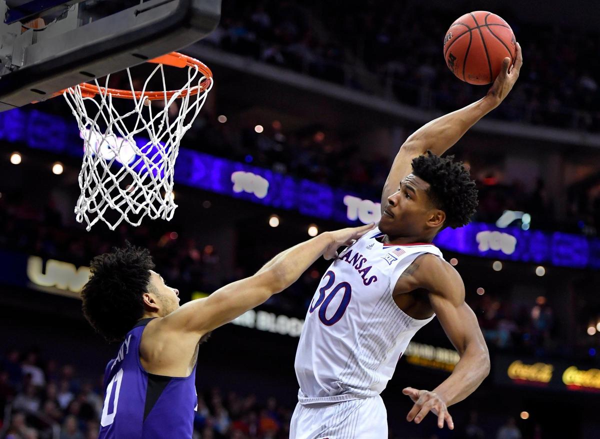 KU’s Ochai Agbaji charged down the lane, grabbed this alley-oop inbounds pass and threw down what had to be the dunk of the tournament over TCU’ s Micah Peaby during the second half of Friday’s semifinal game at the Big 12 Conference Tournament in Kansas City. KU beat TCU, 75-62.