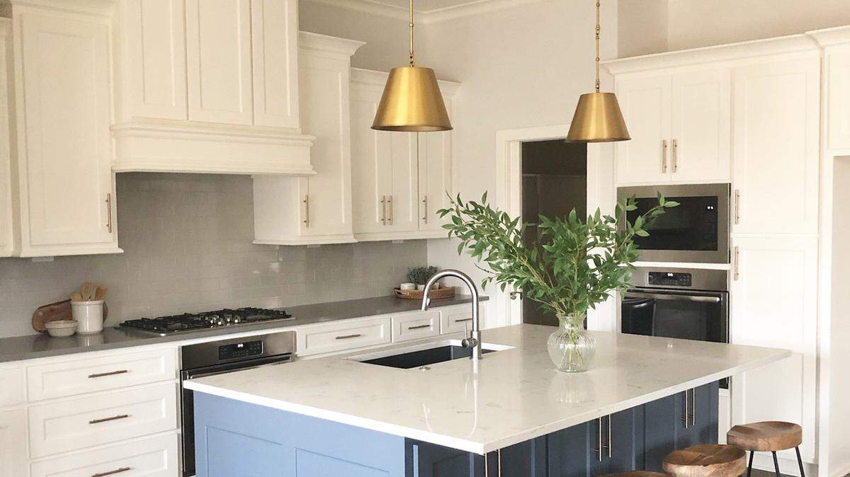 The spacious kitchen in the Alexander plan features a large island, abundant cabinet storage plus a walk-in pantry.  