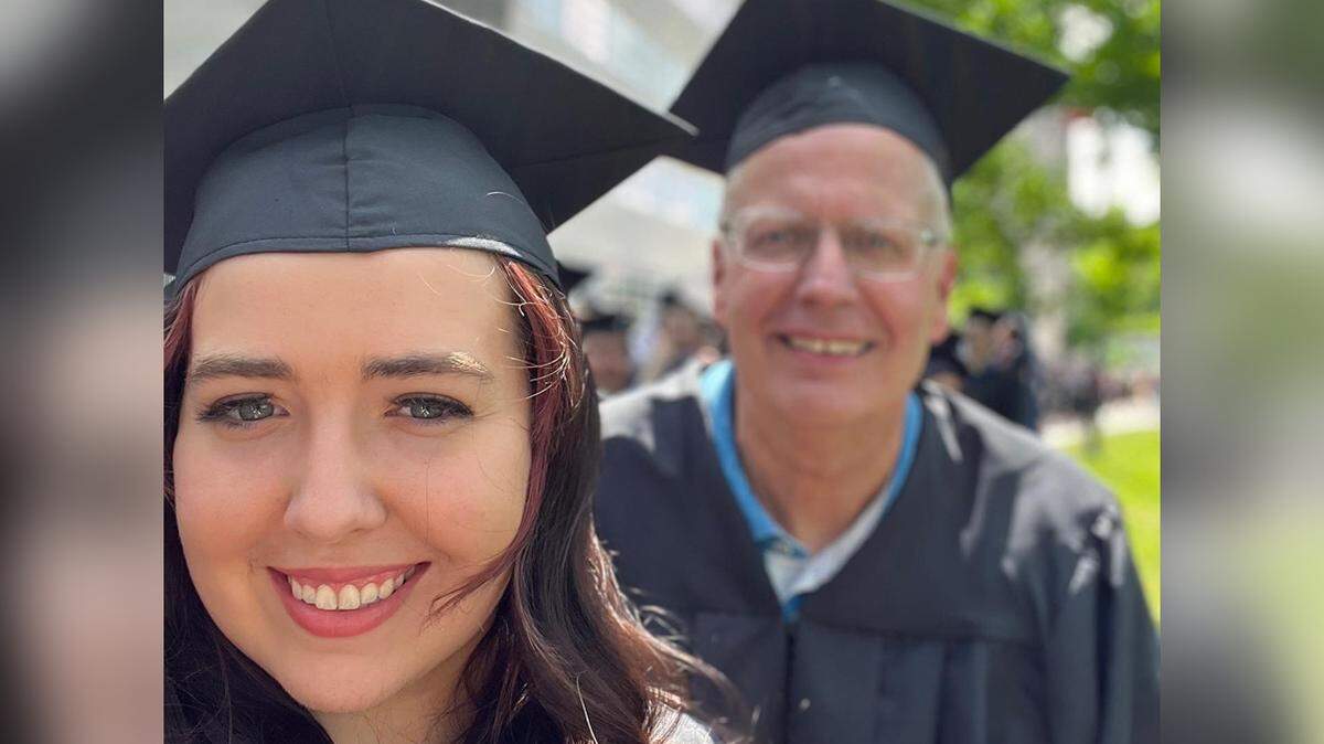 David S. Awbrey walked down the hill alongside his daughter Grace this year. His 1970 ceremony was truncated after the Kansas Union burned down.