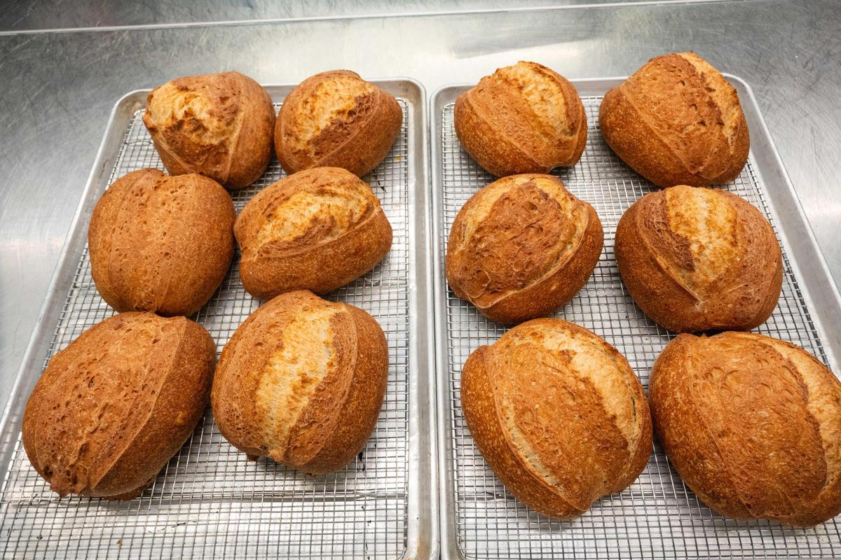 Loaves of sourdough bread fresh form the oven at Green Dirt on Oak. The restaurant has pivoted to increased production of less enriched dough items due to the shortage and rising costs of eggs across the country.