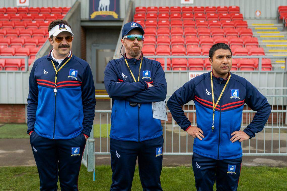 In season one, Ted Lasso (Jason Sudeikis, left) is set up to fail as a newly minted British soccer coach. Season two is more about his internal strife. Brendan Hunt, center, and Nick Mohammed co-star.