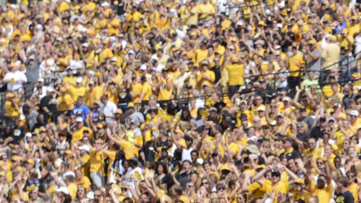 Missouri running back Russell Hansbrough celebrates with teammates after his touchdown run in the first quarter of the Tigers' season opener against South Dakota State at Faurot Field in Columbia.