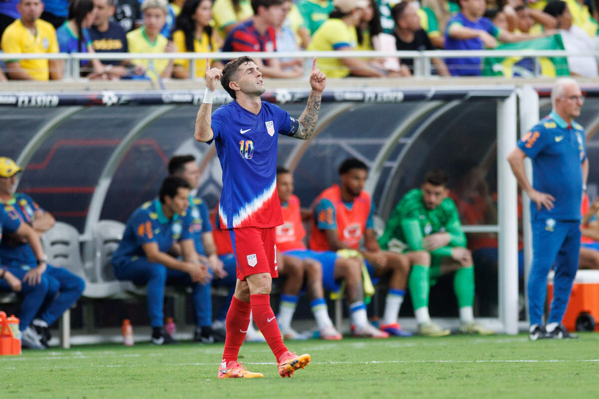United States midfielder Christian Pulisic (10) celebrates after scoring a goal against Brazil in the first half during the Continental Clasico at Camping World Stadium on June 12, 2024.